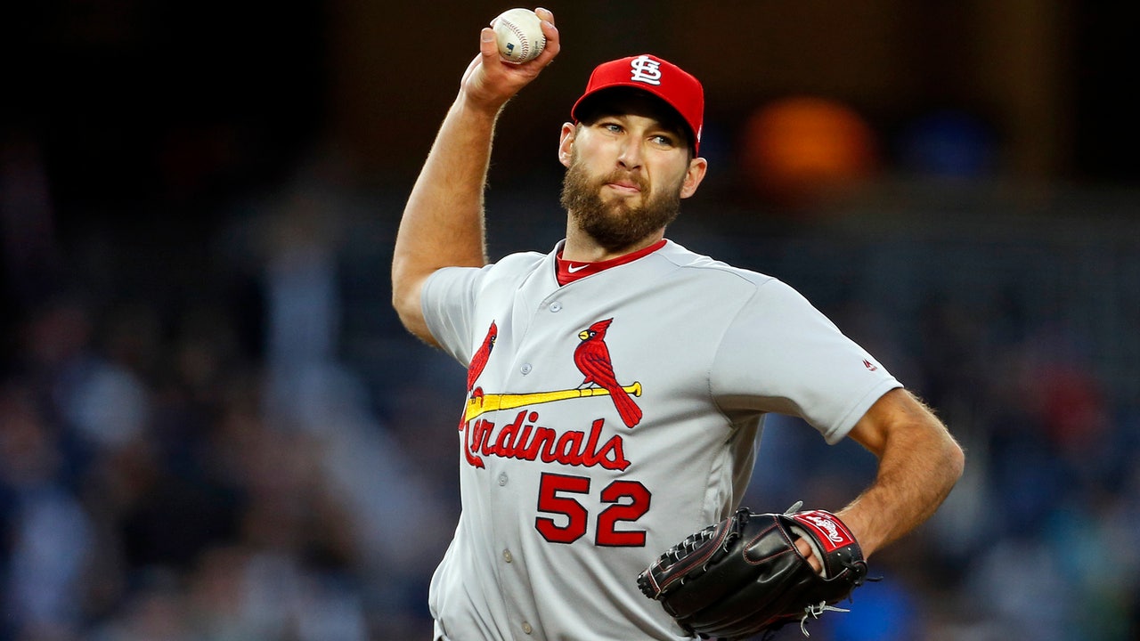 Cardinals look to avoid being swept under the lights at Wrigley